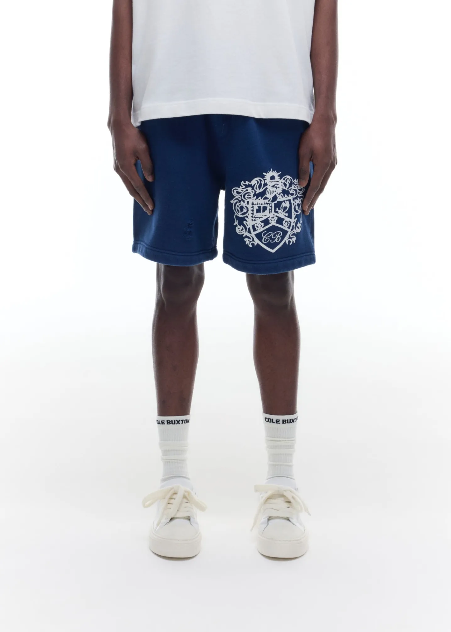 DISTRESSED COLLEGIATE CREST SHORTS